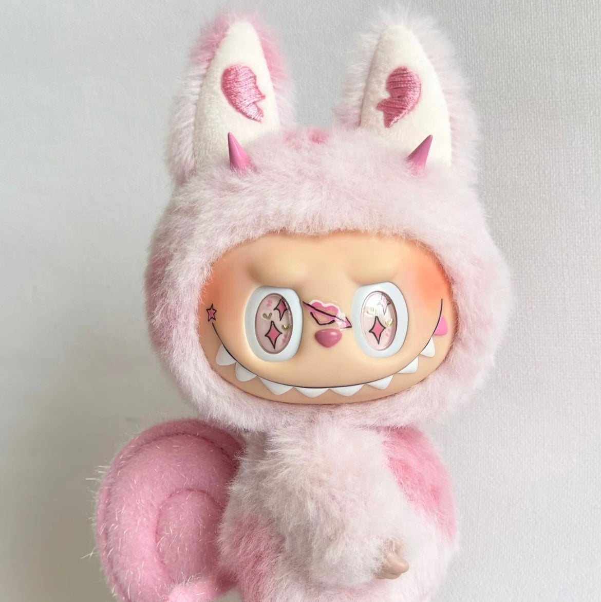 Plush toy with a cute design on a light gray background